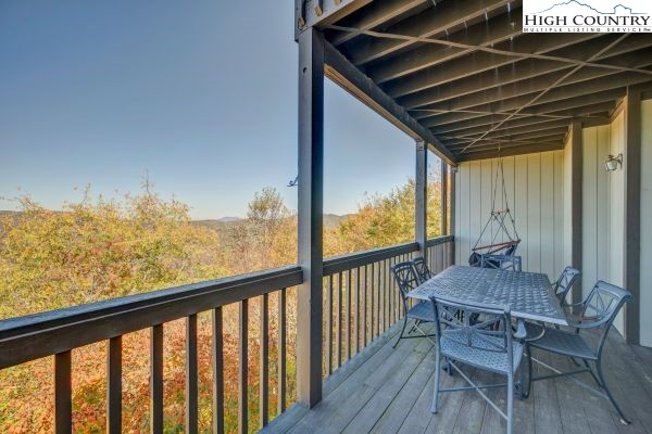 144 Skyleaf Lane, Unit 703 Sugar Mountain, NC 28604 - Photo 16 of 29 a view of balcony with furniture and wooden floor