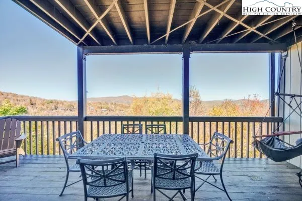 a view of a chairs and table on the deck