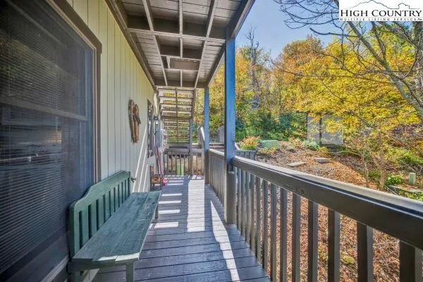 a view of a balcony with wooden floor