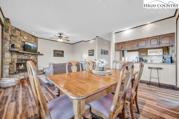 a view of a dining room with furniture and wooden floor