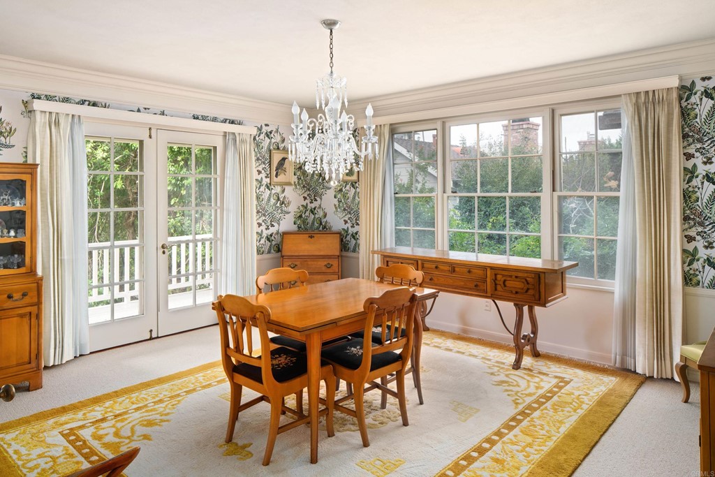 1380 Park Row La Jolla, CA 92037 - Photo 12 of 51 a dining room with furniture a chandelier and wooden floor
