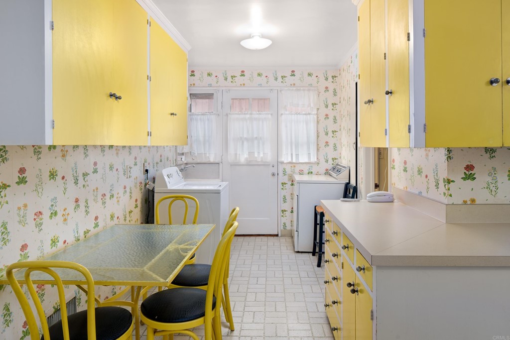 1380 Park Row La Jolla, CA 92037 - Photo 17 of 51 a bathroom with a granite countertop sink a bathtub and a window