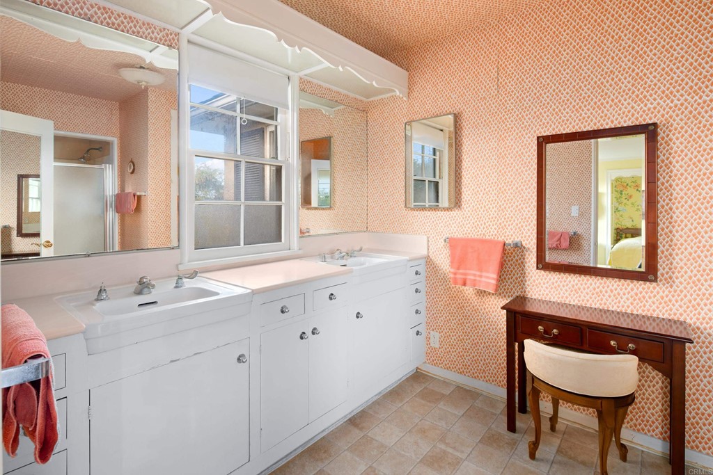 1380 Park Row La Jolla, CA 92037 - Photo 20 of 51 a bathroom with a sink and a mirror