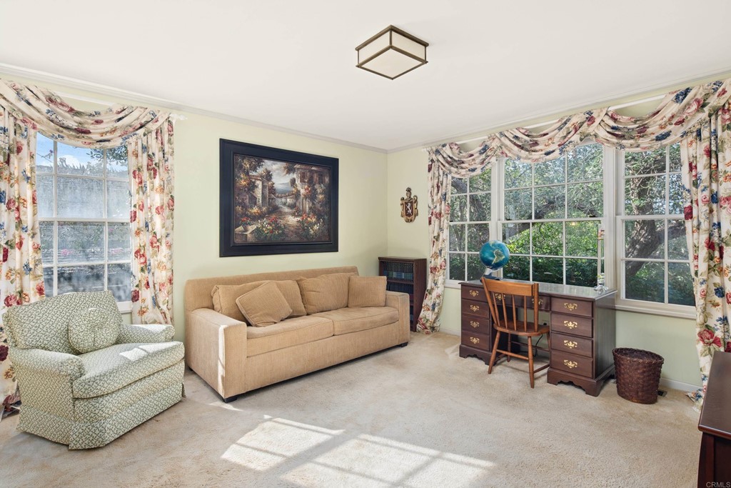 1380 Park Row La Jolla, CA 92037 - Photo 24 of 51 a living room with furniture a rug and a large window