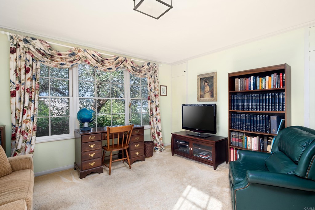 1380 Park Row La Jolla, CA 92037 - Photo 25 of 51 a living room with furniture and a flat screen tv