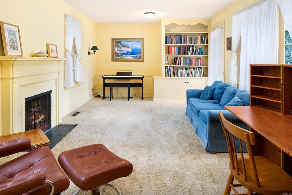 1380 Park Row La Jolla, CA 92037 - Photo 27 of 51 a living room with furniture and a fireplace