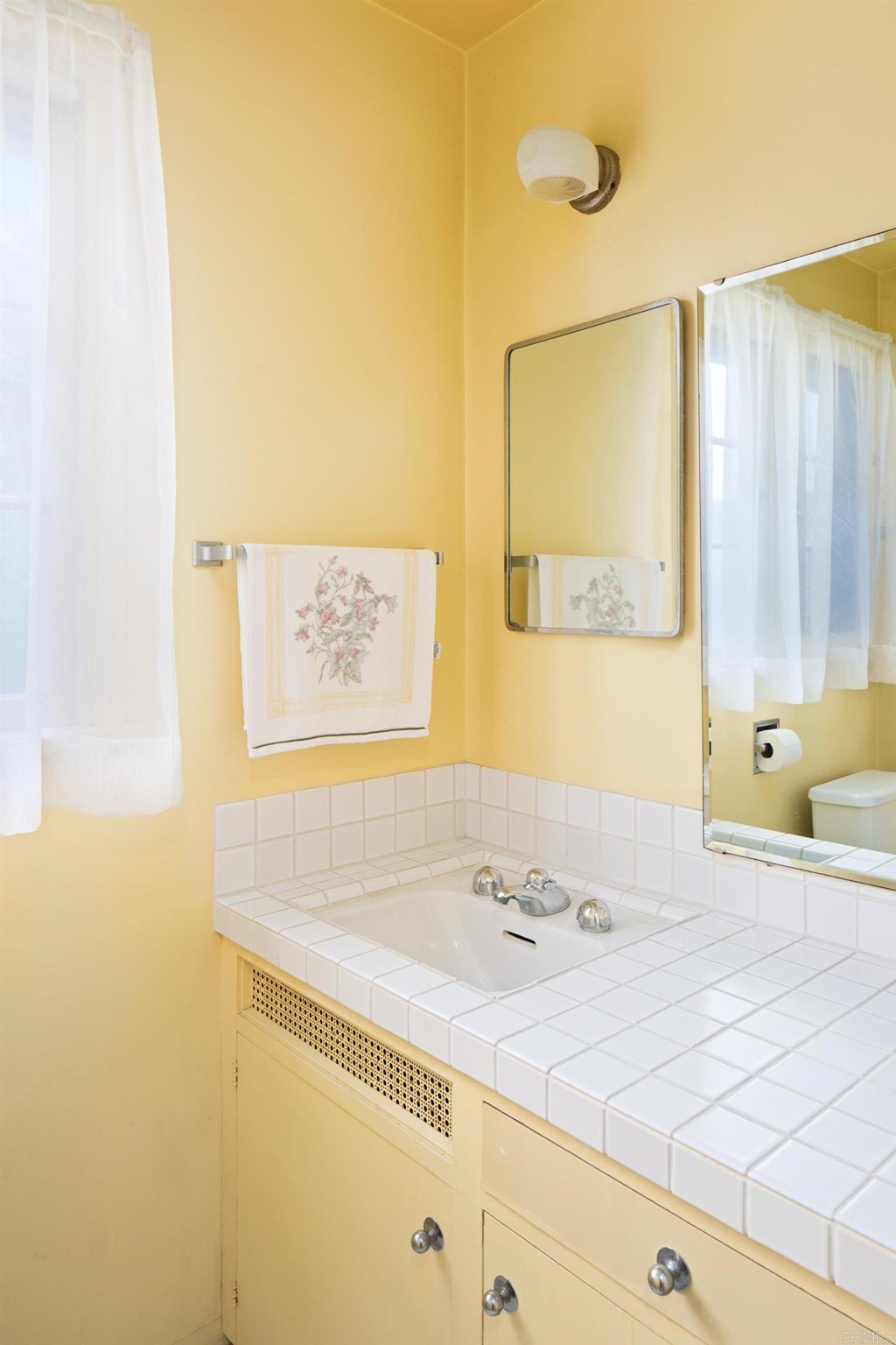 1380 Park Row La Jolla, CA 92037 - Photo 29 of 51 a bathroom with a sink and a mirror