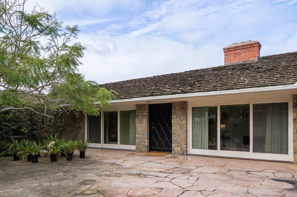 1380 Park Row La Jolla, CA 92037 - Photo 3 of 51 a front view of a house with a garden
