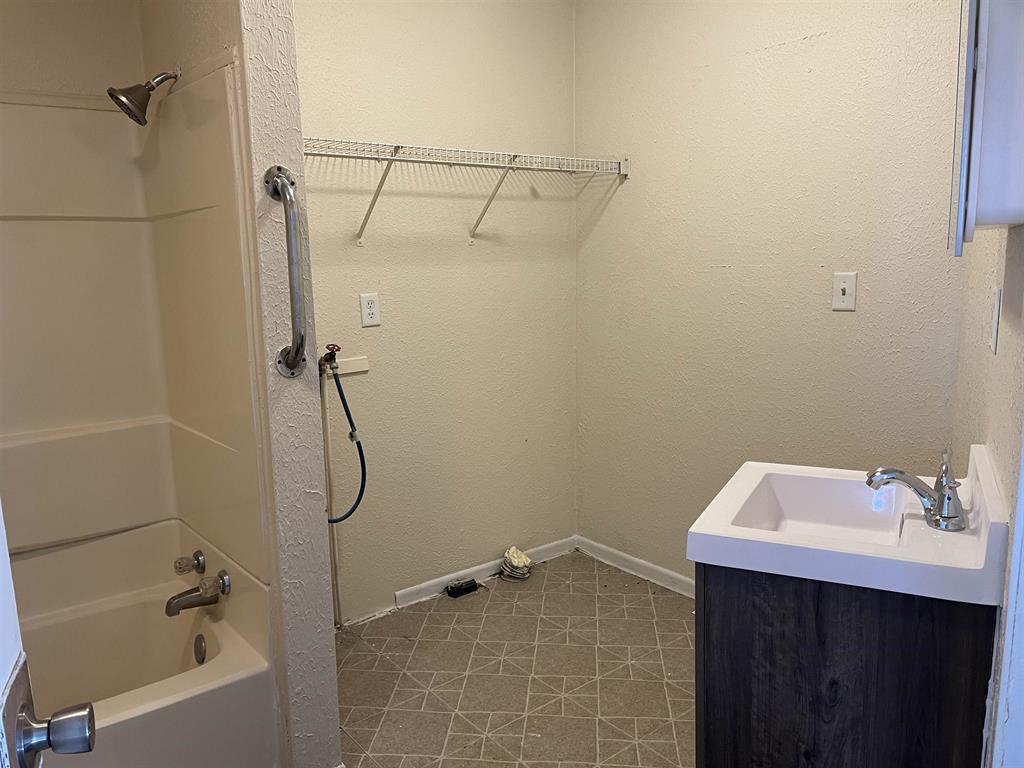 458 South Float Avenue Freeport, IL 61032 - Photo 11 of 11 a bathroom with a sink a vanity and shower
