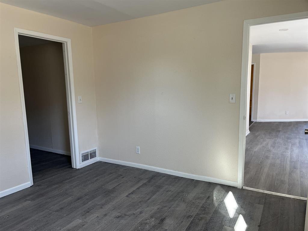 458 South Float Avenue Freeport, IL 61032 - Photo 7 of 11 an empty room with wooden floor and closet