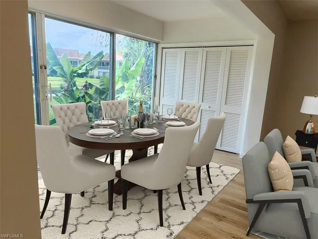 a view of a dining room with furniture window and outside view
