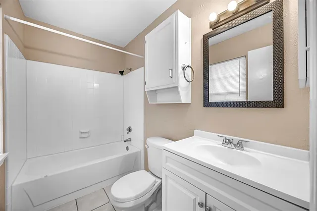 a bathroom with a sink a toilet and a bathtub