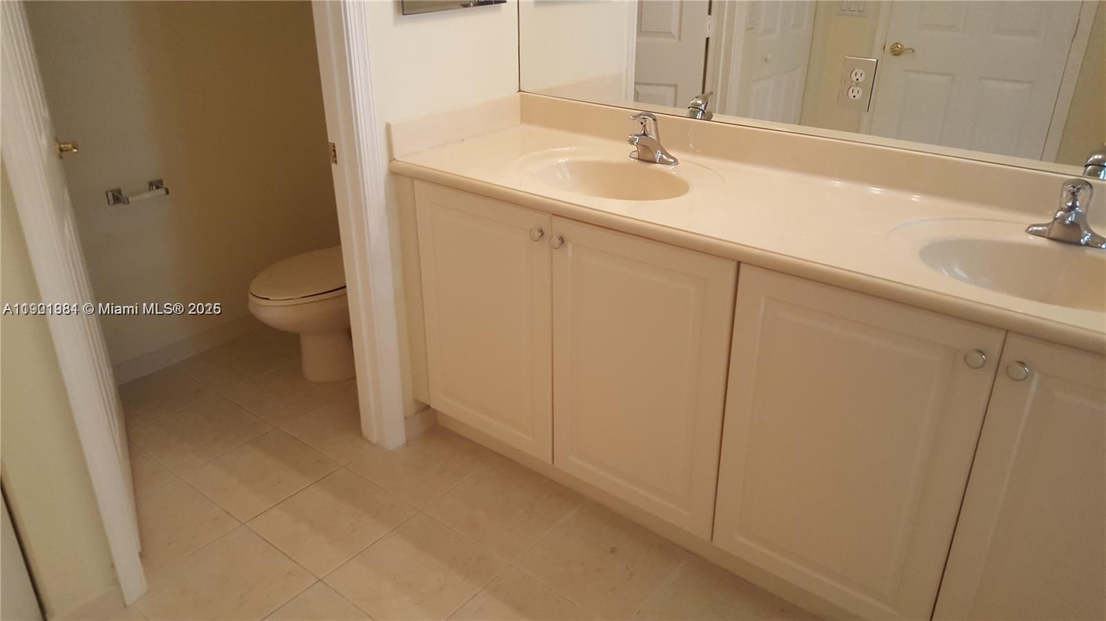 2853 Southwest 85th Avenue, Unit 103 Miramar, FL 33025 - Photo 17 of 20 a bathroom with a sink and a toilet