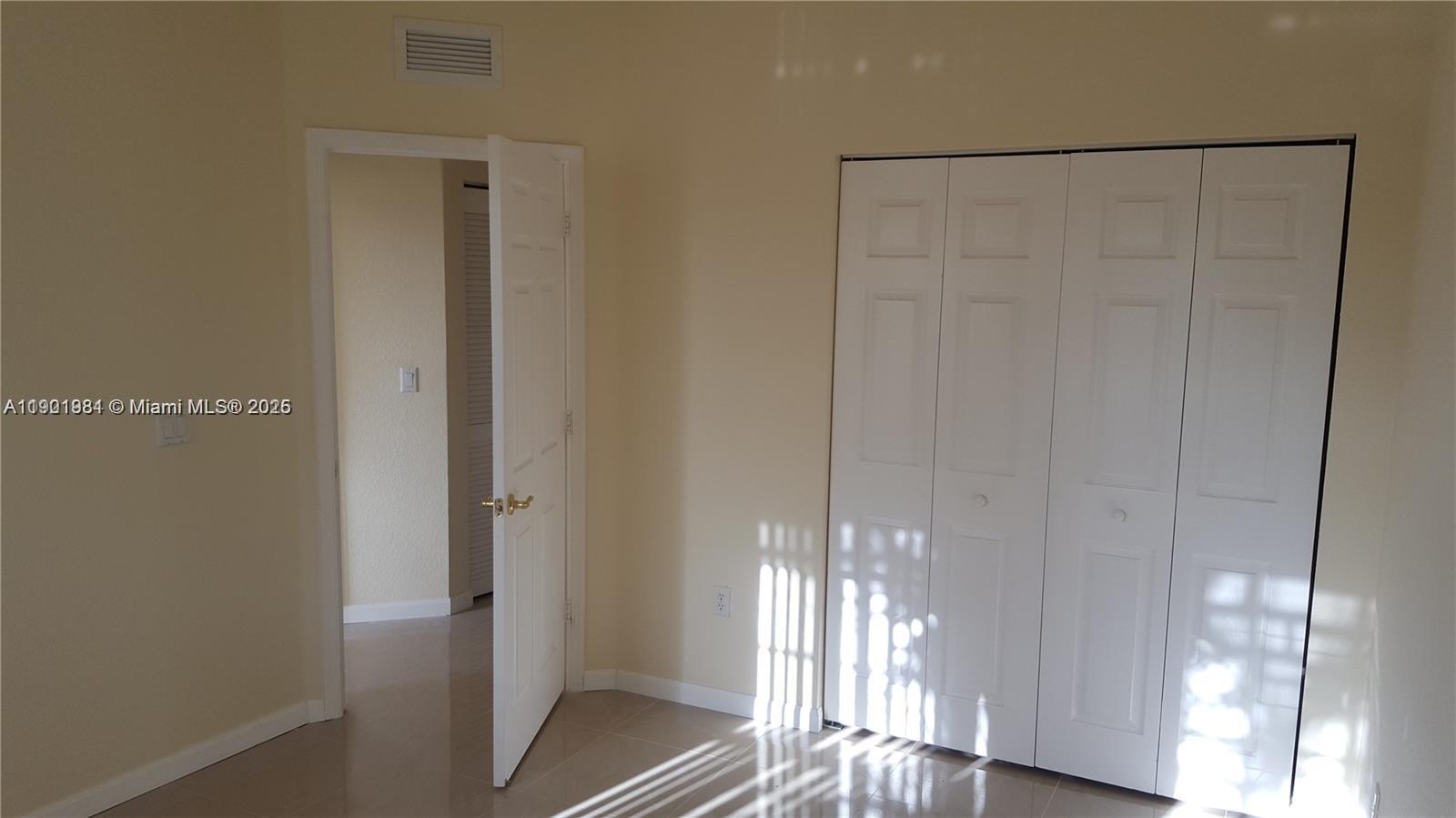 2853 Southwest 85th Avenue, Unit 103 Miramar, FL 33025 - Photo 6 of 20 a view of entryway with wooden floor
