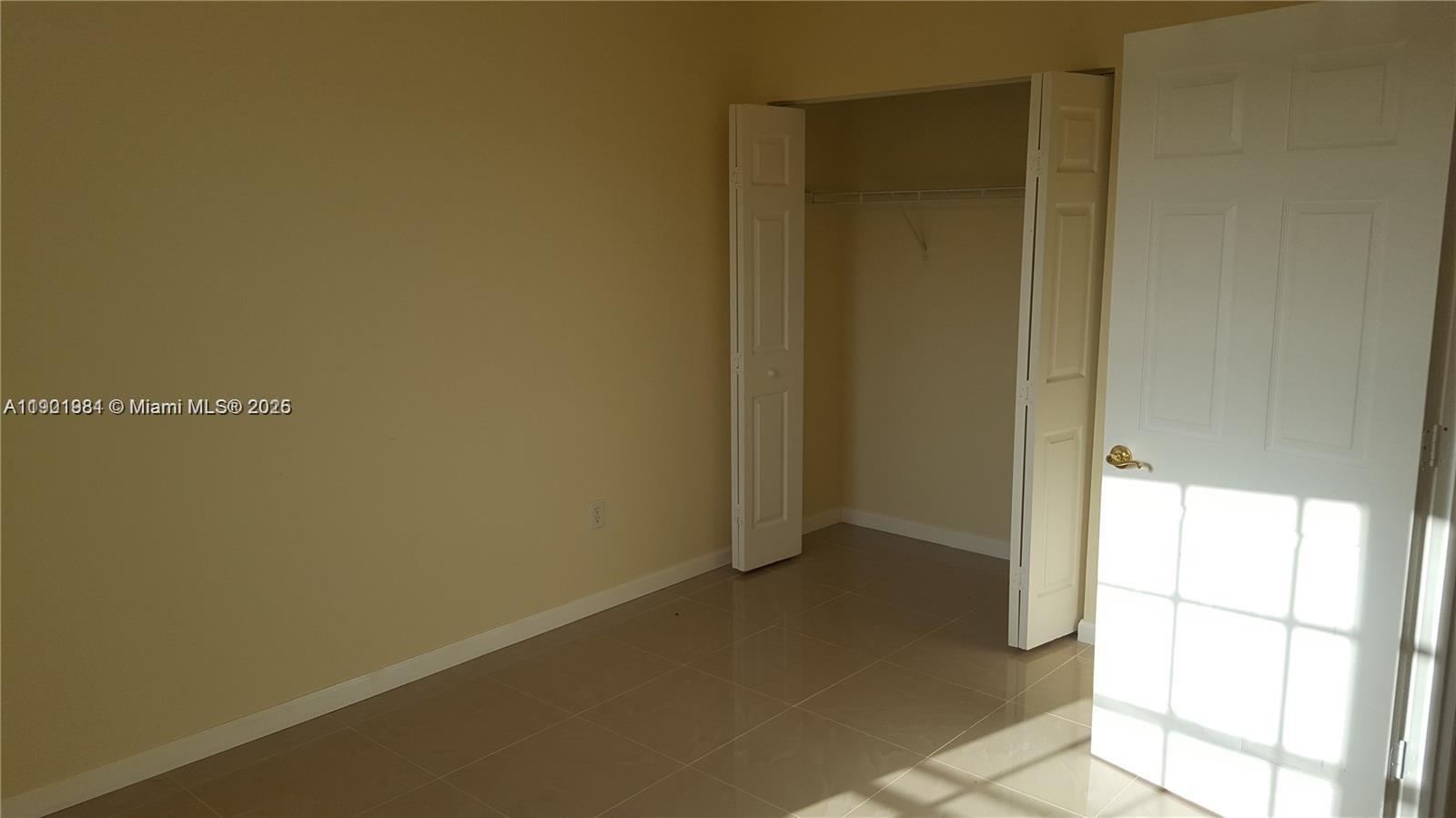 2853 Southwest 85th Avenue, Unit 103 Miramar, FL 33025 - Photo 8 of 20 a view of an empty room