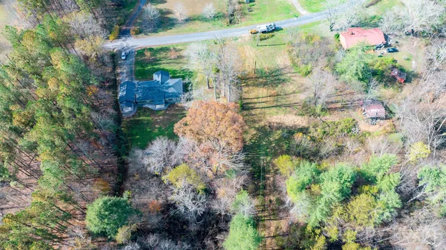 an aerial view of residential house with outdoor space