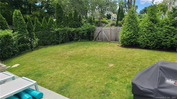a view of a backyard with potted plants