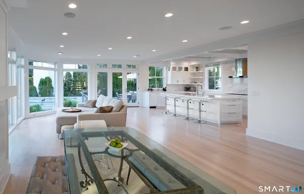 a view of a living room kitchen and a wooden floor