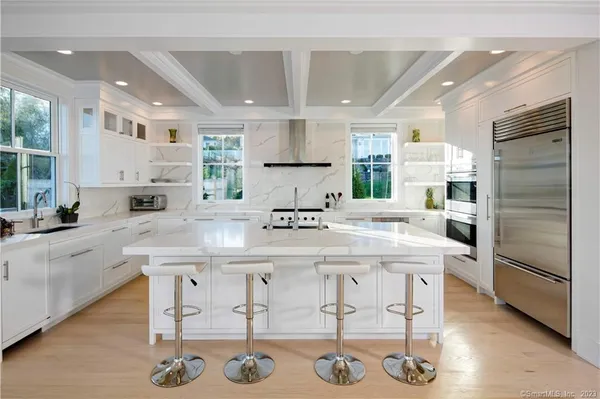 a kitchen with stainless steel appliances granite countertop a sink and cabinets