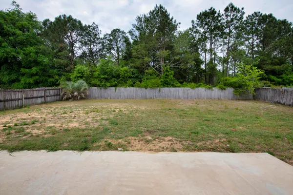 a view of a swimming pool with a yard