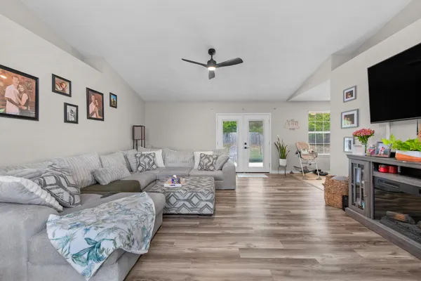 a living room with furniture and a flat screen tv