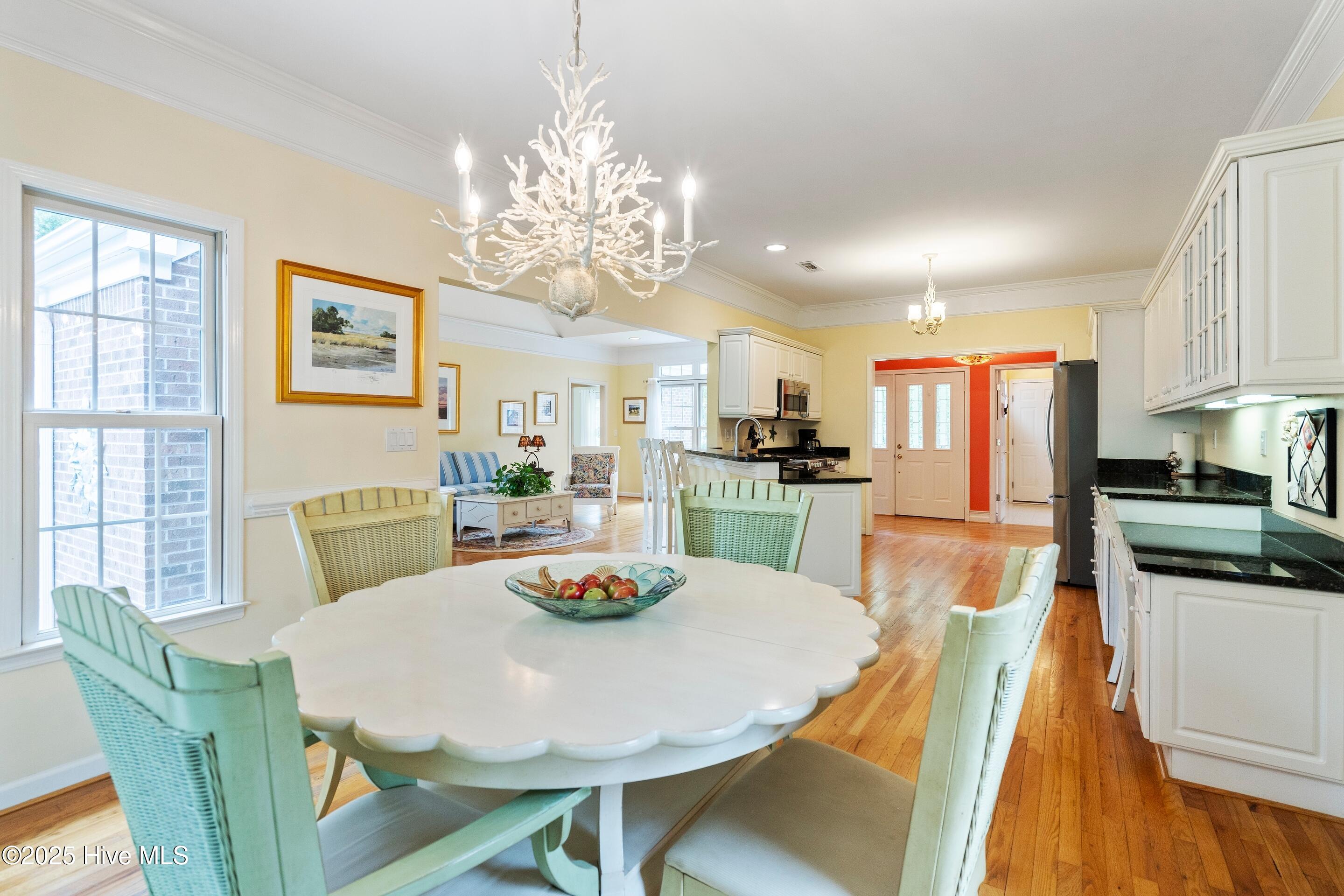 1020 Cordgrass Road Hampstead, NC 28443 - Photo 13 of 65 Eat in dining room located between the kitchen and and sunroom