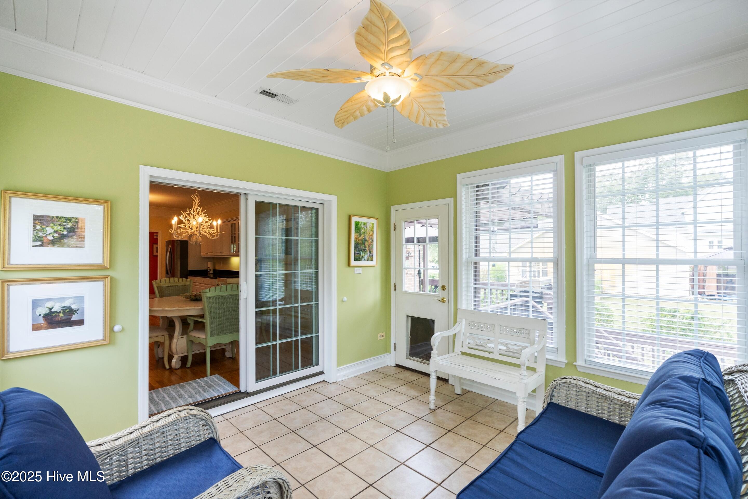 1020 Cordgrass Road Hampstead, NC 28443 - Photo 17 of 65 Heated and cooled sunroom with slider and door to deck and door opposite side to patio