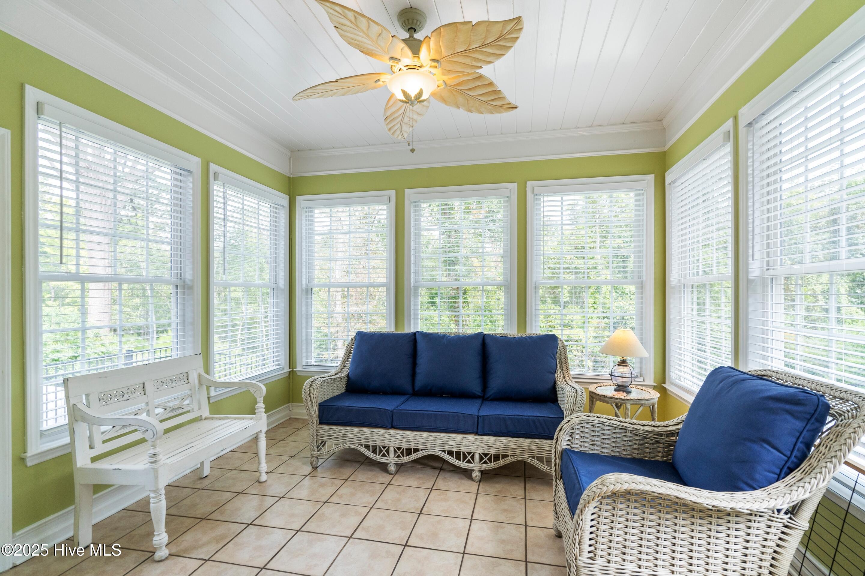 1020 Cordgrass Road Hampstead, NC 28443 - Photo 18 of 65 enjoy tons of sunlight overlooking wooded yard leading to creek below.