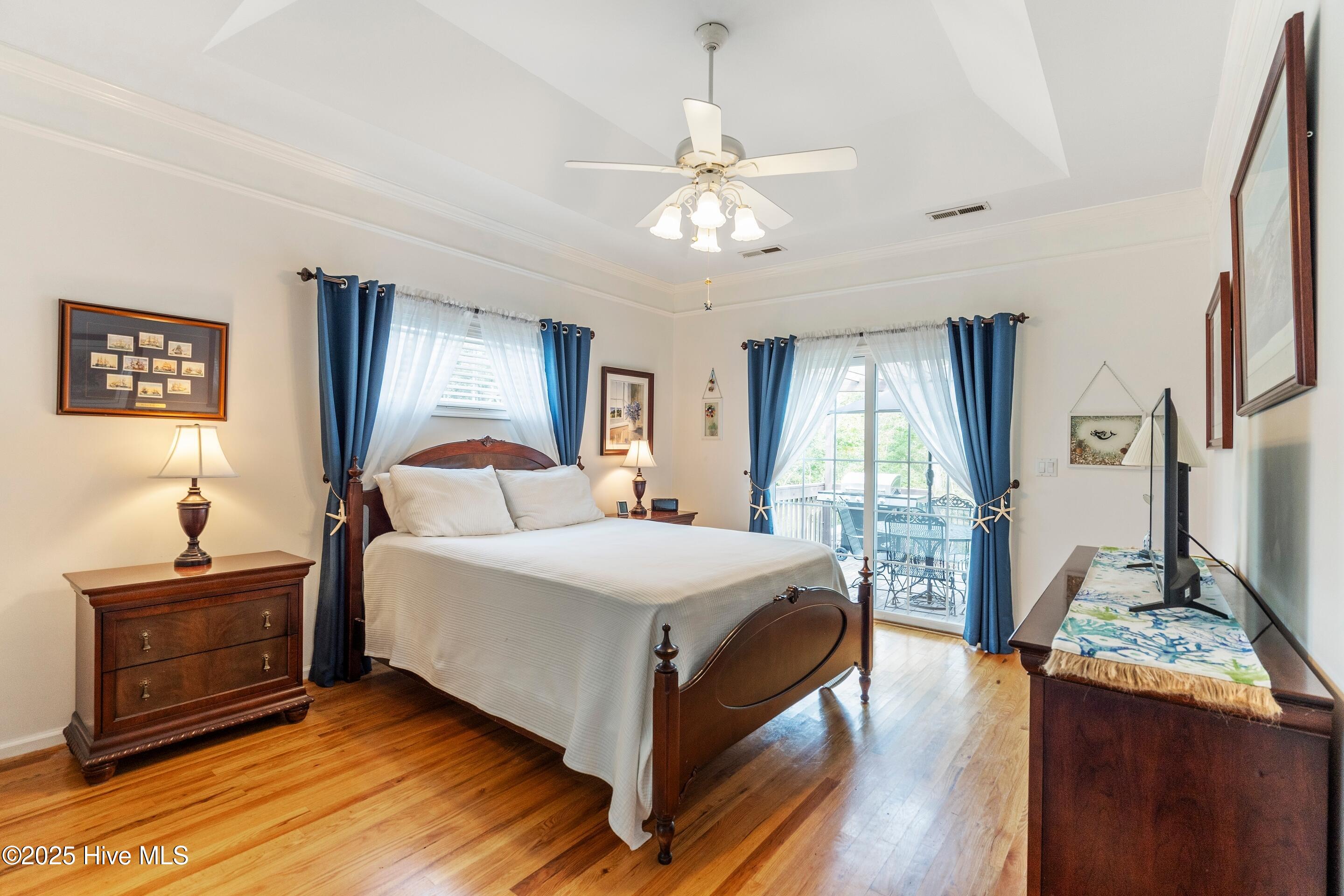 1020 Cordgrass Road Hampstead, NC 28443 - Photo 30 of 65 Master bedroom with vaulted ceiling and deck access