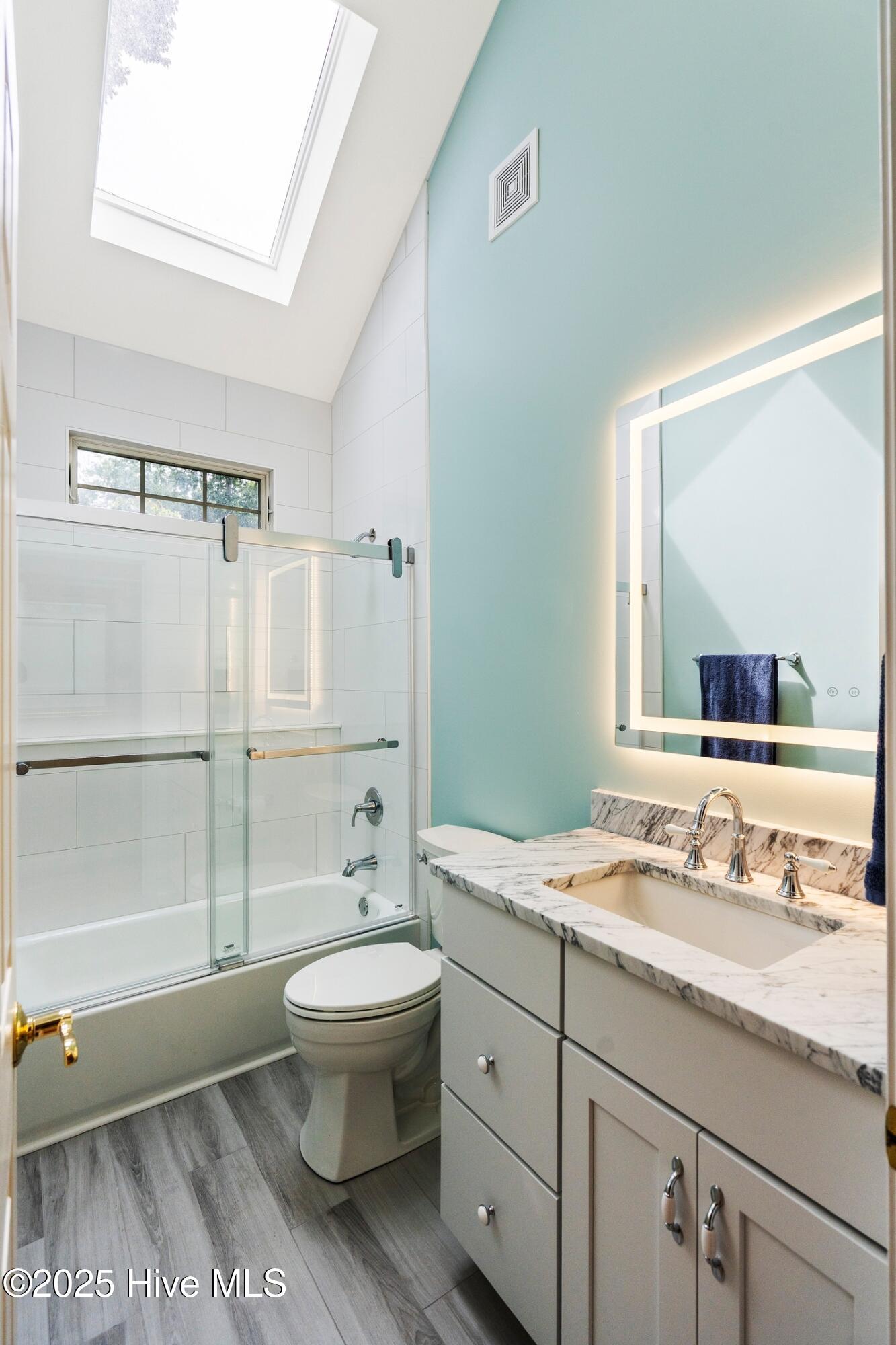 1020 Cordgrass Road Hampstead, NC 28443 - Photo 35 of 65 Updated guest bathroom with LED mirror