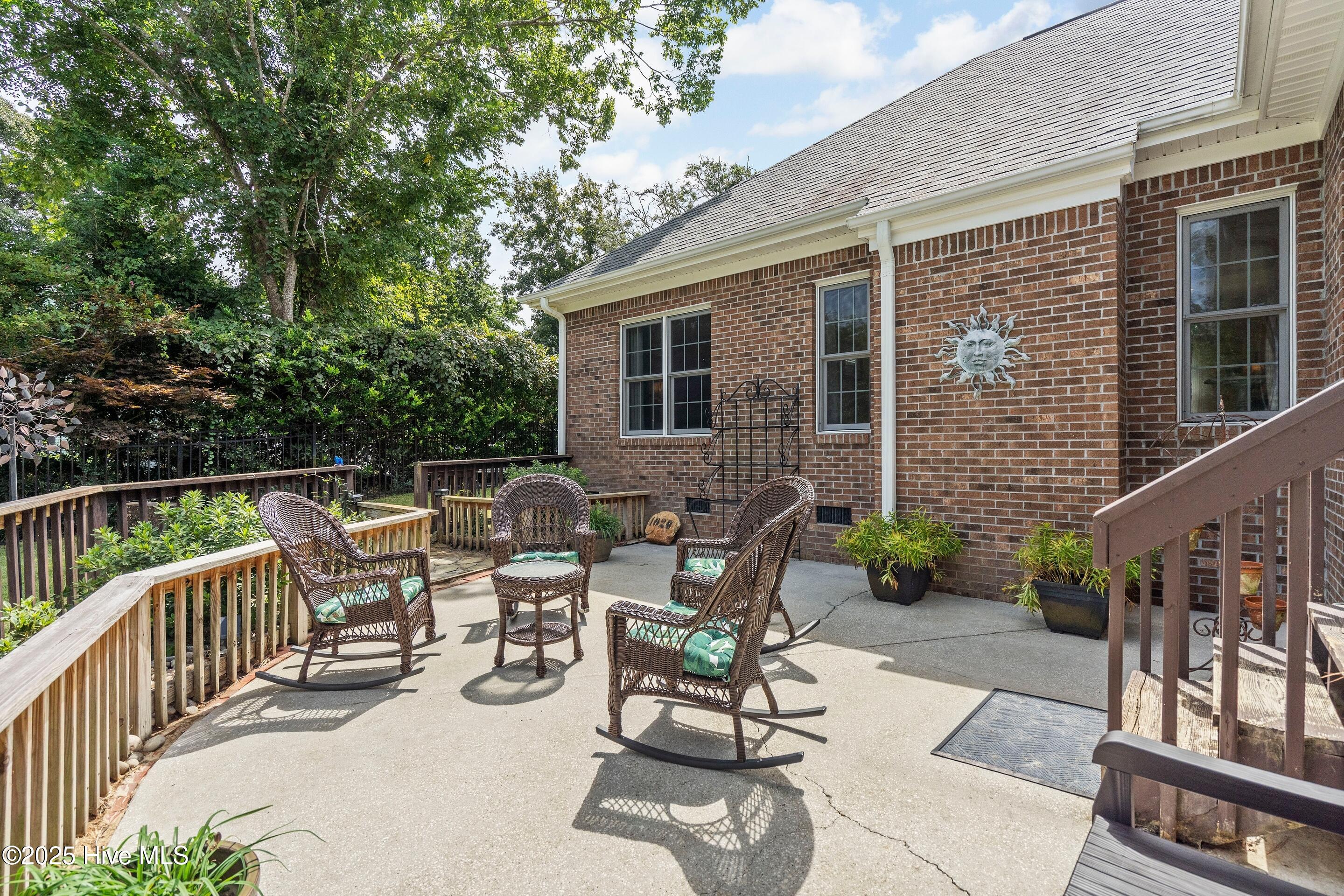 1020 Cordgrass Road Hampstead, NC 28443 - Photo 39 of 65 Rear patio overlooking wooded view