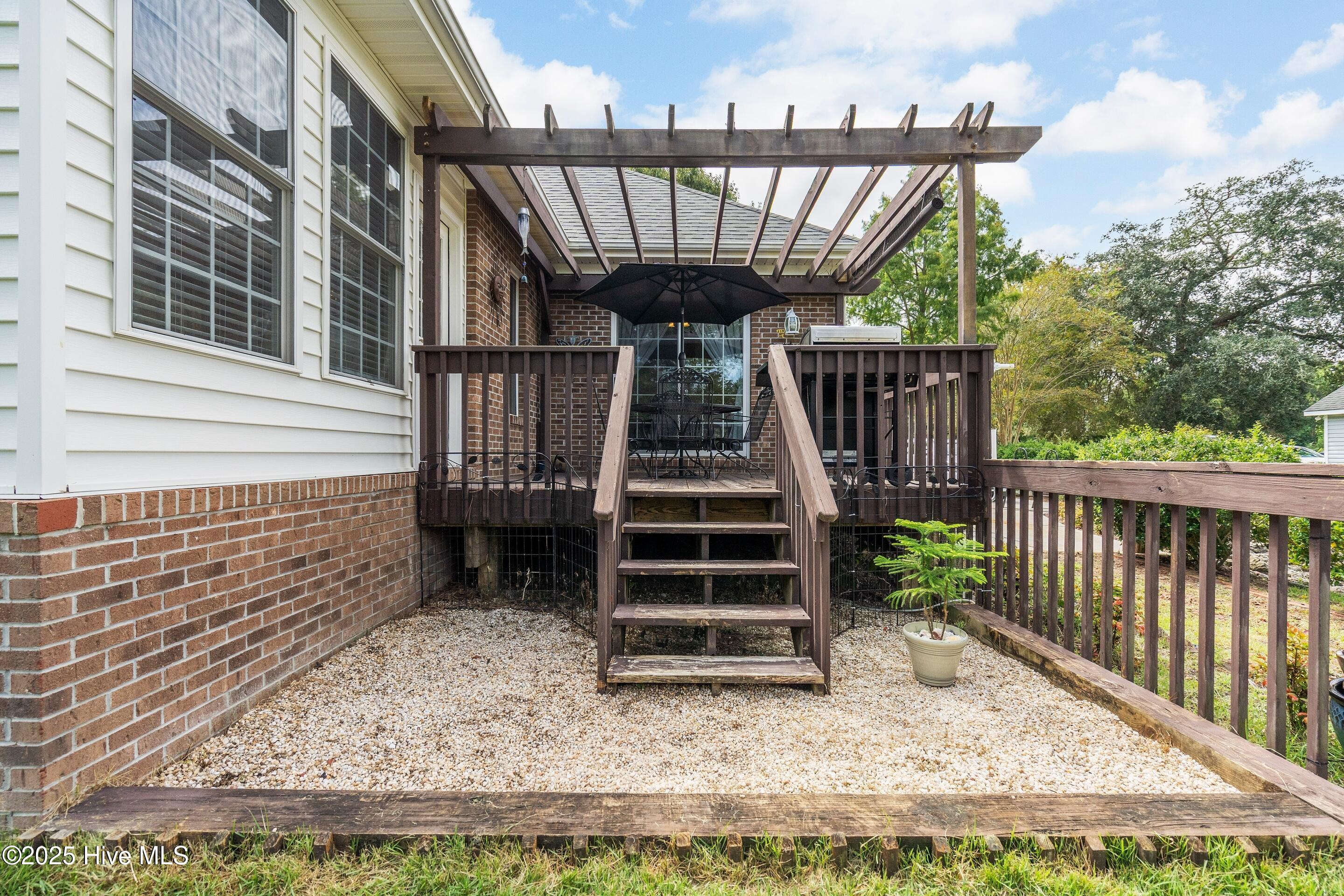 1020 Cordgrass Road Hampstead, NC 28443 - Photo 46 of 65 Back deck of master and sunroom