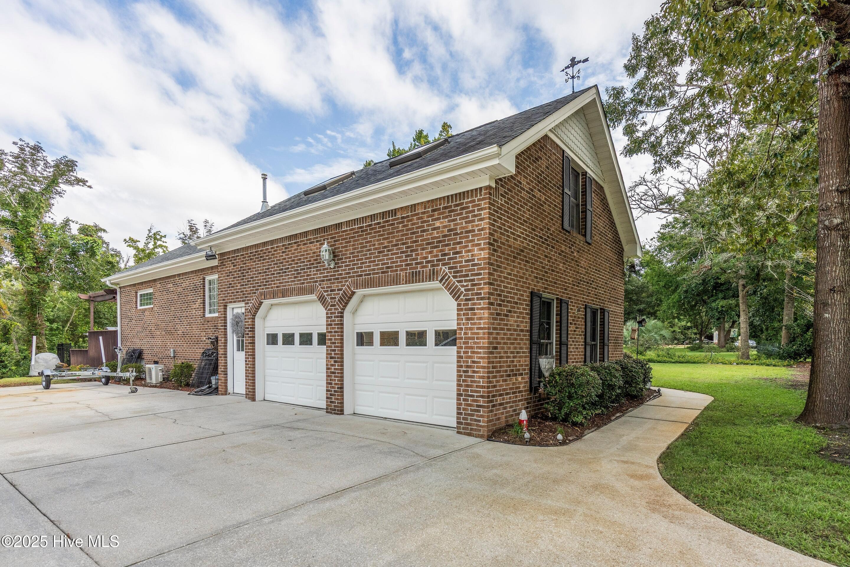 1020 Cordgrass Road Hampstead, NC 28443 - Photo 5 of 65 Two car garage with oversized driveway
