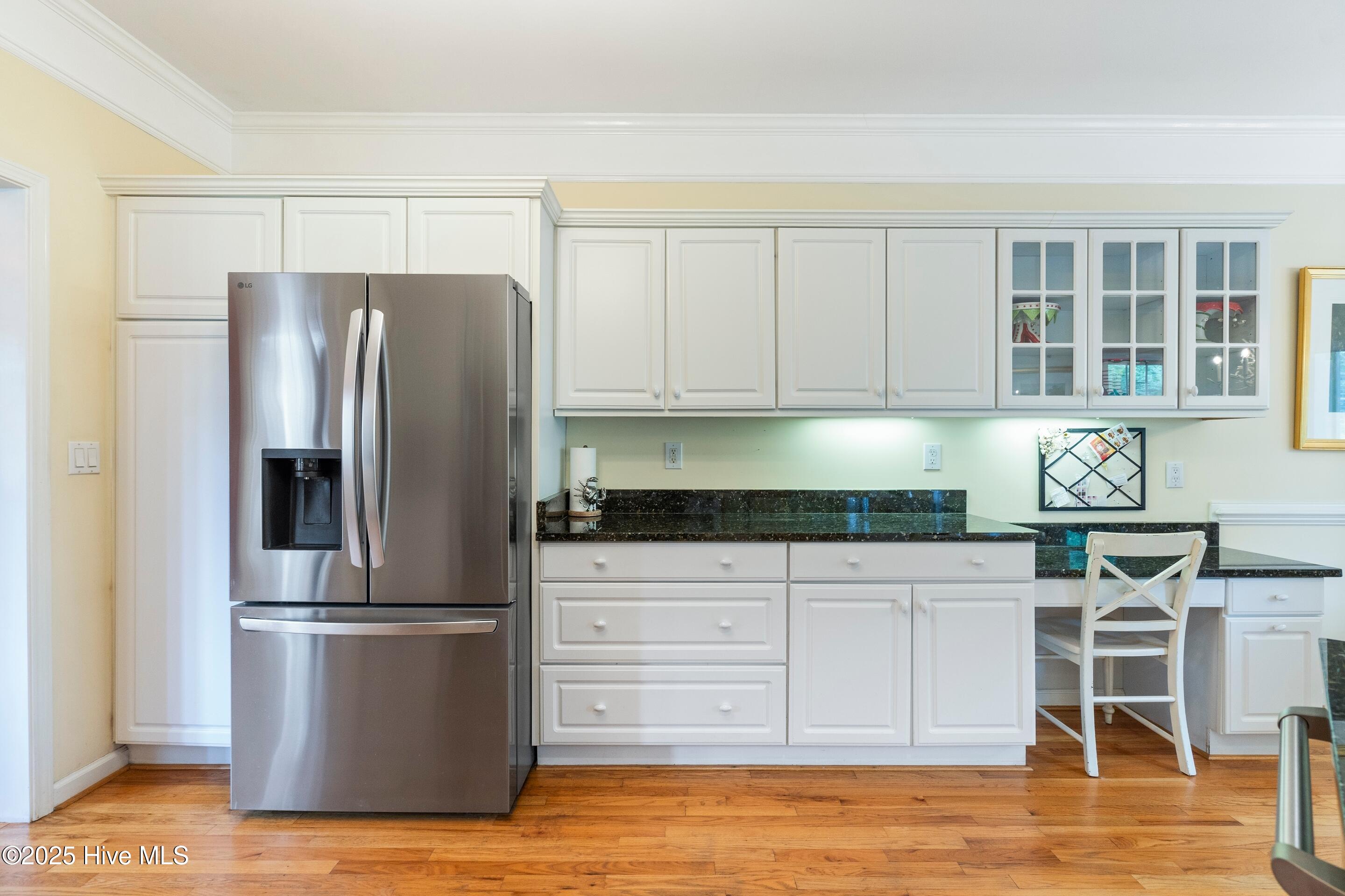 1020 Cordgrass Road Hampstead, NC 28443 - Photo 10 of 65 Kitchen with hardwood floors, fridge that conveys, absolute black granite countertops