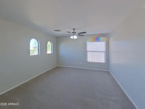 a bathroom with a toilet and shower