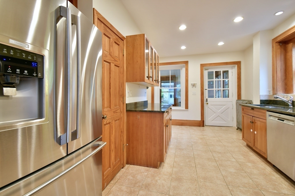 141 Beacon Street Boston, MA 02136 - Photo 14 of 40 a view of a kitchen with refrigerator and windows