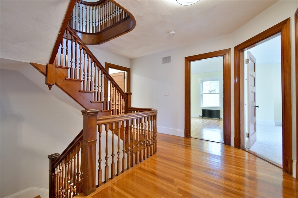 141 Beacon Street Boston, MA 02136 - Photo 17 of 40 a view of staircase with railing and white walls