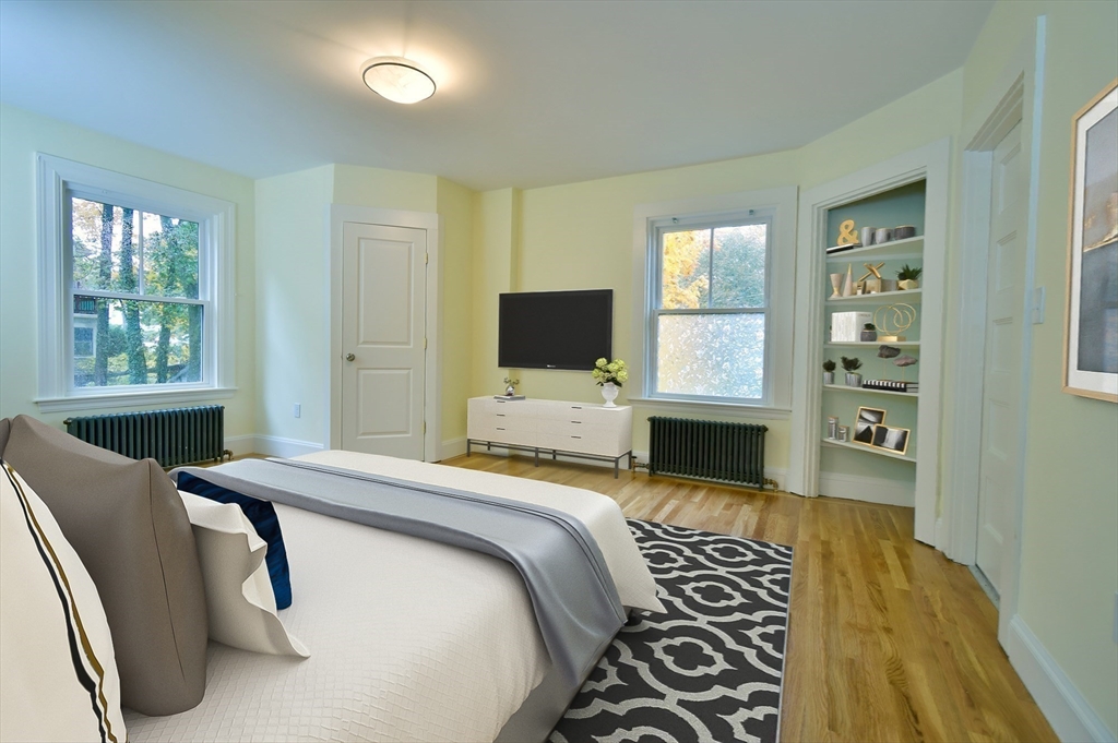 141 Beacon Street Boston, MA 02136 - Photo 23 of 40 a bedroom with furniture and a flat screen tv