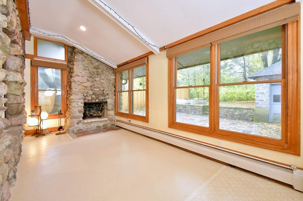 141 Beacon Street Boston, MA 02136 - Photo 35 of 40 a view of an empty room with a fireplace and a window