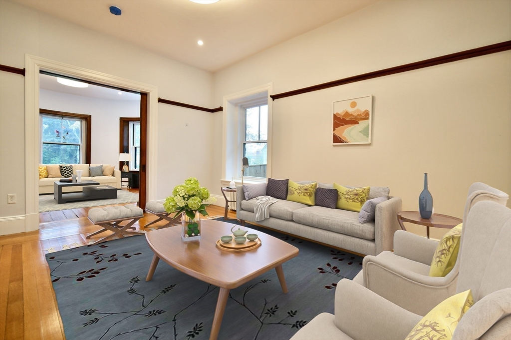 141 Beacon Street Boston, MA 02136 - Photo 9 of 40 a living room with furniture and wooden floor