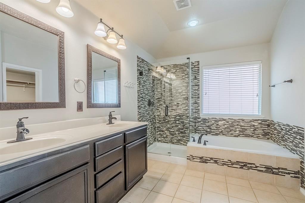 1109 Johnson City Avenue Forney, TX 75126 - Photo 28 of 40 a bathroom with a sink and a bathtub