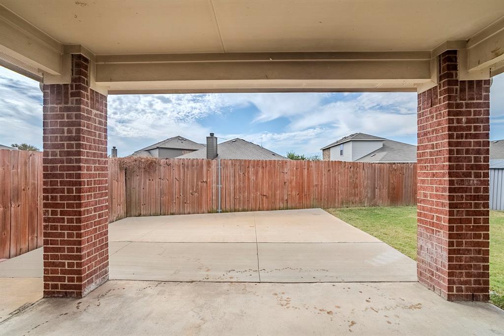 1109 Johnson City Avenue Forney, TX 75126 - Photo 37 of 40 a view of backyard with wooden fence