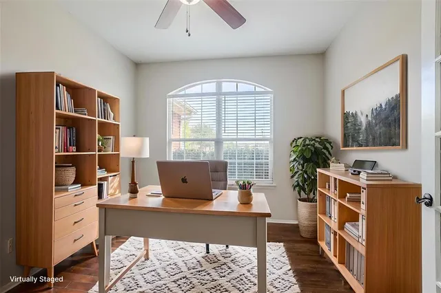 a workspace with furniture window and wooden floor