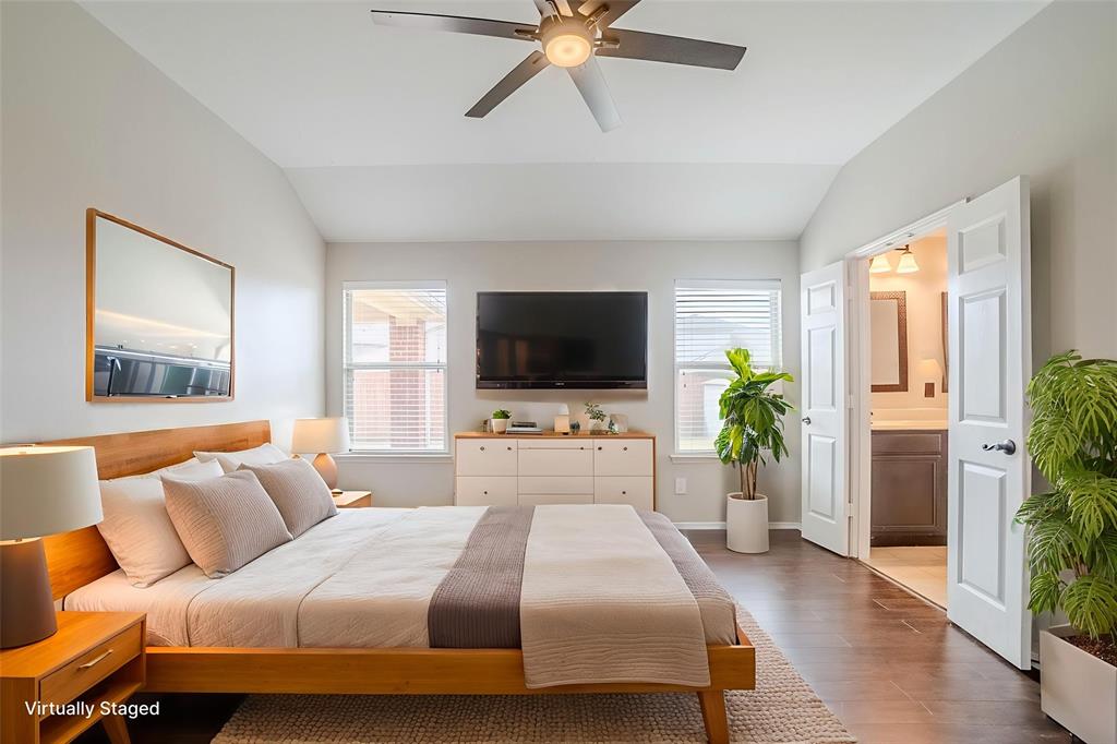 1109 Johnson City Avenue Forney, TX 75126 - Photo 7 of 40 a bedroom with a bed television on desk and a window