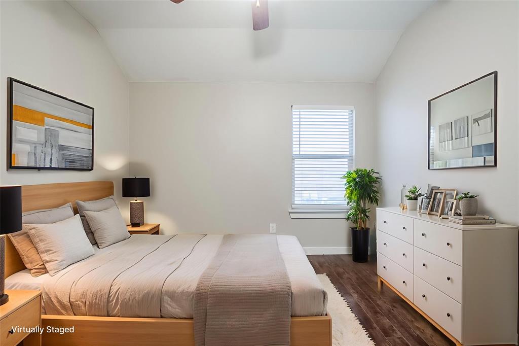 1109 Johnson City Avenue Forney, TX 75126 - Photo 9 of 40 a bedroom with a bed and a potted plant