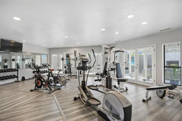 a kitchen with stainless steel appliances a white stove top oven and cabinets