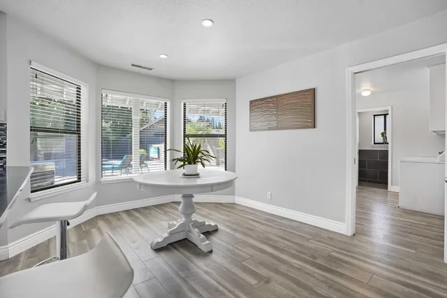 a kitchen with a refrigerator and a stove