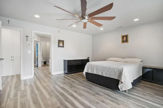 a bathroom with a double vanity sink mirror and shower