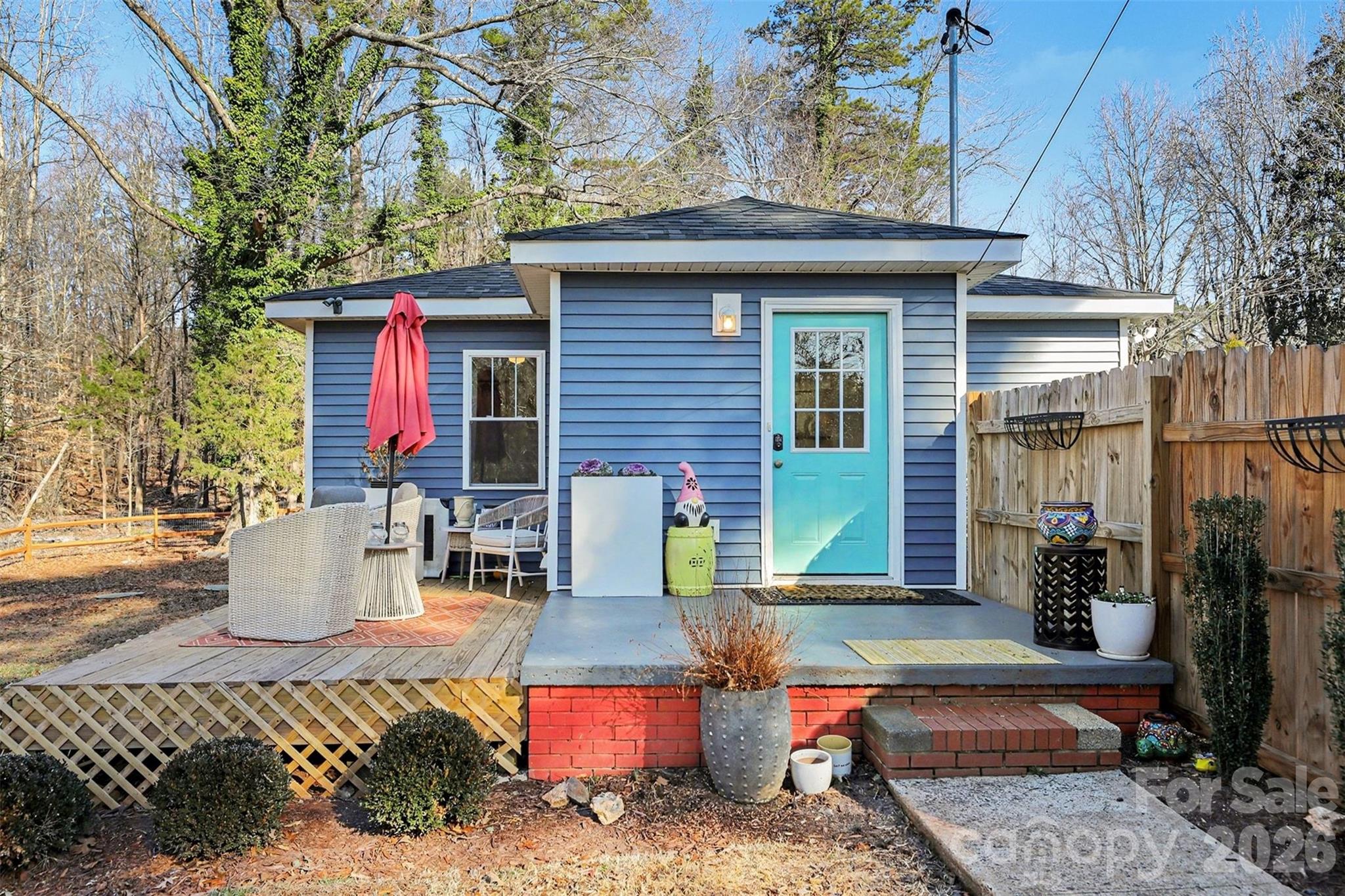 1760 Shearers Road Davidson, NC 28036 - Photo 15 of 18 a view of a wooden chairs and table in the patio