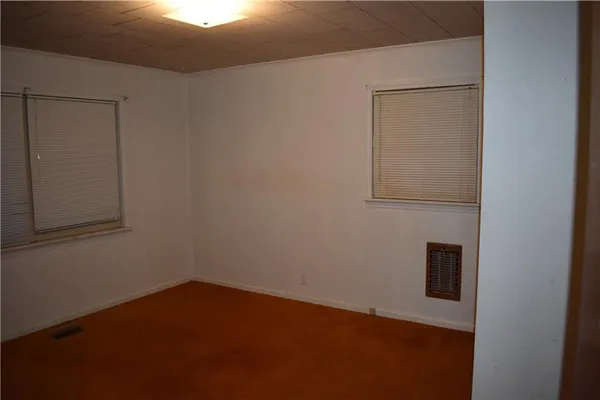 a kitchen with a refrigerator and cabinets